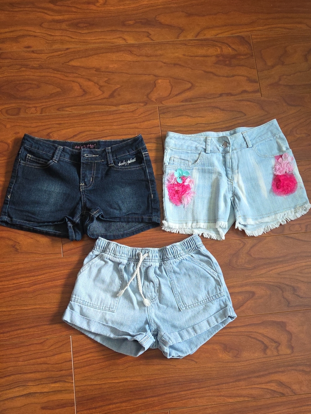 Light Blue Denim Shorts with Pink Pom-Pom Accent